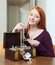 Teenager girl looks jewelry in treasure chest