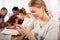 Teenager girl at school using smartphone