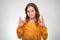 Teenager girl showing OK sign with finger, smiling