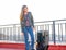 Teenager girl standing outdoor at roof terrace