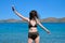 Teenager girl in sunglasses bikini, enjoying sea water in the bay