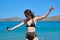 Teenager girl in sunglasses bikini, enjoying sea water in the bay