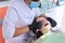 Teenager girl treating teeth at dentist office, consultation of orthodontist