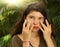 Teenager girl using sun protecion cream on face