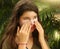 Teenager girl using sun protecion cream on face close up photo