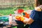 Teenager girl washing dishes outdoors at countryside