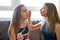 Teenager girls best friends makeup each other