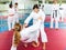 Teenager girls practicing karate in pairs