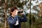 Teenager guy looking with binoculars