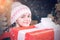 Teenager hold Christmas gift box. Happy Little girl with Christmas gift box. Cute little girl near Christmas tree