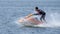 Teenager on Jet Ski-Water Sports in the summer having fun on the beach