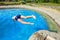 Teenager jumping into pool