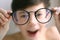 Teenager kid boy in myopia correction glasses