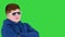 Teenager kid wearing sunglasses standing with arms crossed convinced and confident on a Green Screen, Chroma Key.