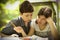 Teenager kids siblings sister help her brother with homework task