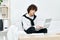 teenager laptop sitting on white sofa online training Lifestyle technology