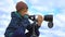 A teenager looks through a telescope.