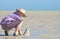 Teenager making sandcastles