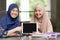 Teenager muslim students with tablet