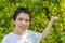 Teenager next to peach trees