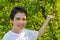 Teenager next to peach trees