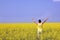 teenager in oilseed field - summer background