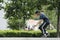 A teenager practices with his skateboard