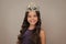 Teenager princess child celebrates success win and victory. Teen girl in queen crown. Happy girl face, positive and