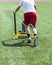 Teenager pushing a sled with weights for resistance training