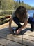 Teenager releasing fish