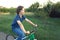 Teenager riding a bicycle on the road summer sunlit