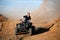 Teenager riding quad four wheeler