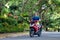 Teenager riding scooter. Boy on motorcycle.