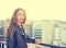 Teenager rock girl standing outdoor at roof terrace