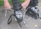 Teenager`s hands lace up roller skates