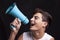 Teenager shouting with megaphone