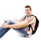 Teenager sitting on floor with book and rucksack