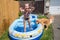 Teenager splashing in inflatable pool