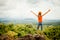 Teenager standing on a mountain top