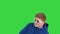 Teenager with sunglasses doing some cool dancing moves on a Green Screen, Chroma Key.