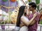 Teenager sweet couple show love each other, young beautiful woman puts her arms around boyfriend`s neck, lover hug each other,