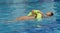 Teenager with swimming tyre in the water