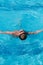 Teenager swims in pool