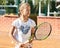 Teenager tennis player girl training court girl racket ball brunette long hair sun portrait learn green summer green