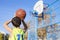 Teenager throwing a basketball into the hoop from behind