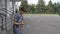 Teenager trying border balance kendama trick balancing the spike stick on the ball outdoor -