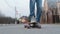 Teenager very close to the camera on a skateboard, close-up of legs