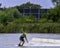 Teenager wakeboarding on a lake