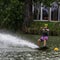 Teenager wakeboarding on a lake