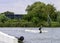 Teenager wakeboarding on a lake - Brwinow, Masovia, Poland